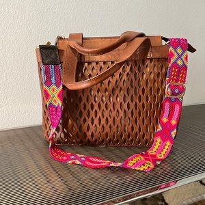 Bixi Awotan leather bag with detachable colorful braided strap.